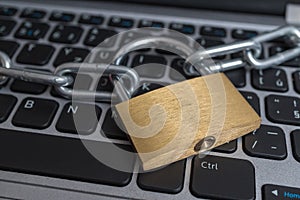 Lock with chain on computer keyboard. Data protection, privacy and security concept.