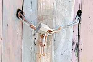 Lock & Chain on Old Wood Texture Background