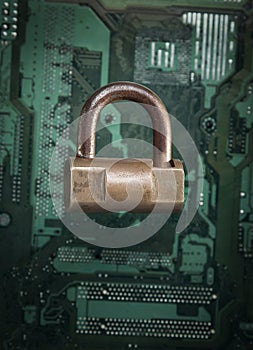 Lock on computer motherboard. Internet data privacy information security concept.