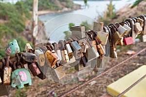 Lock for couple make a promise to love forever, master keys hanging on the rails of bridge, the sign of love and romantic affectio
