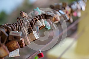 Lock for couple make a promise to love forever, master keys hanging on the rails of bridge, the sign of love and romantic affectio