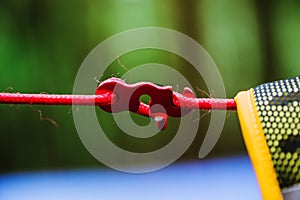 The lock force rope. tent rope buckle. at hanging backpack