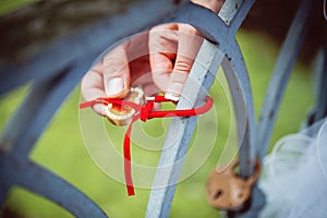 The lock in hands of newlyweds