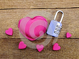 Lock with the heart as a symbol of love vintage on wooden background