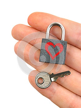 Lock with heart and key in hand