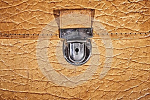 Lock of an old beige leather portfolio