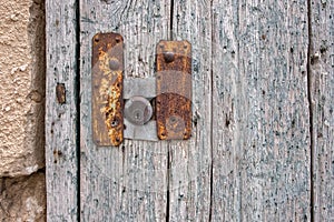 Lock in an old wooden door, rusty metal