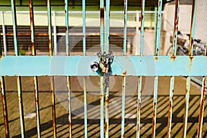 Lock and rusty metal gate