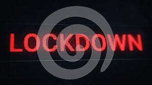 Lockdown banner. Red pixel text