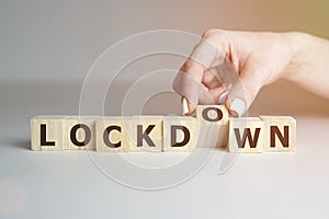 Lockdown, word cube with background. Business concept