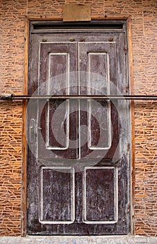Locked brown door in Morocco