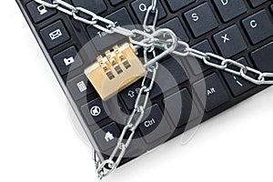 Locked chain on computer keyboard.