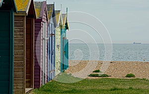 Locked Colorful Beach huts on a pebble beach