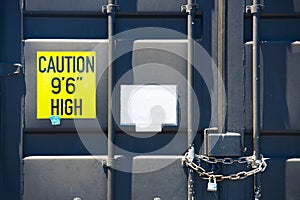 Locked container door with chain