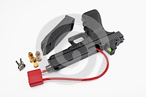 Locked disarmed and secured automatic gun on white background
