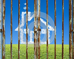 Locked door with cloud house in beautiful landscape green meadow