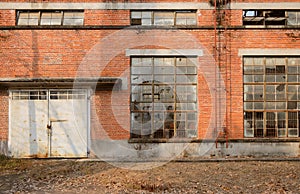 Locked door of deserted 1970s` workshop in boiler factory