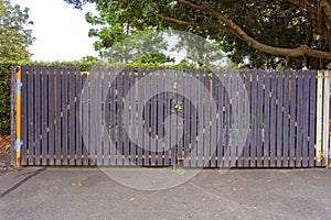 Locked Gate Covering Rubbish Bins