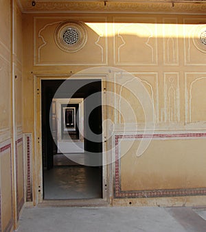 Locked in Home - A Long Corridor of Rectangular Doors with a Human Silhouette in Darkness