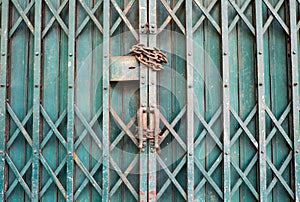 Locked lock metal door with a chain