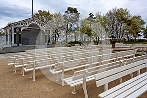Locked open air stage and empty spectator benches near the beach during the coronavirus pandemic in the famous tourist resort
