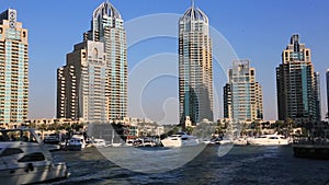 Locked-on shot of modern buildings at Dubai Marina, United Arab Emirates