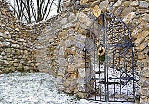 Locked steel doors in stony wall