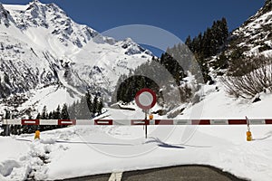 Locked Susten pass road in winter in the Alps in Switzerland