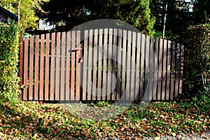 Locked wooden picket fence gate