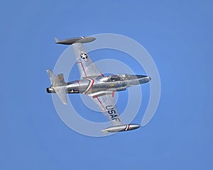 Lockheed T-33 Shooting Star flying over Duck Creek with other Warbirds prior to the traditional fireworks display.