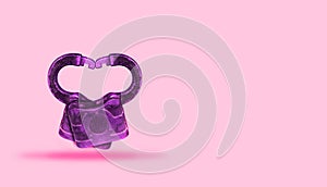 A Locking of Hearts: Two Locks on pink background intertwine to Form a Heart