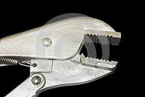 Locking Pliers isolated on black background