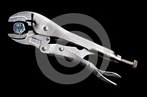 Locking pliers locked on to a bolt