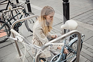 Locking up her Bicycle