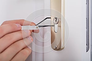 Lockpicker Hand Fixing Door Handle At Home