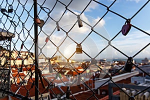 Locks on the cage, Old city on a background