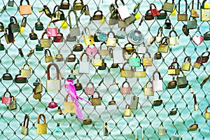 Locks of love on a fence of a grid