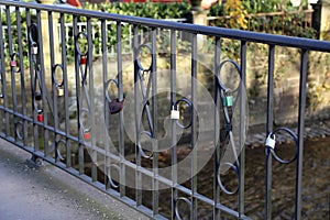 Locks on the railing of the bridge as a token of love