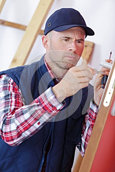 Locksmith man fix bathroom door by screwdriver