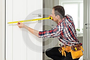 Locksmith, man and maintenance, handyman with home renovation and fixing, change door locks with power tools