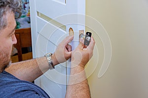 Locksmith professional and efficient installation of new door lock.