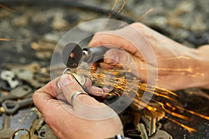 Locksmith in workshop makes new key, use grinding engraving machine