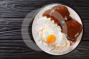 Loco Moco recipe is a delicious Hawaiian dish consists of white rice, a juicy hamburger patty, a fried egg, and brown gravy close-