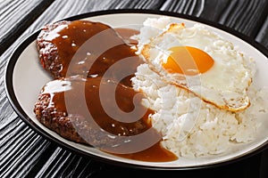 Loco Moco recipe is a delicious Hawaiian dish consists of white rice, a juicy hamburger patty, a fried egg, and brown gravy close-