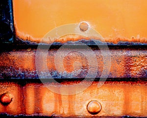 Locomotive design element refrigeration car aged and worn plates that exibit yellow and brillant orange hues.