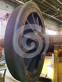 Locomotive metal driving wheel in repair shop