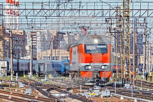 Locomotive and passenger carriages on the station