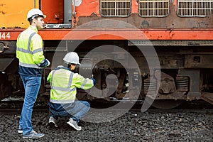 Locomotive repair worker, Train Engineer technician on duty working Maintenance Rolling Stocks of old diesel train passenger cabin