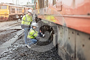 Locomotive repair worker, Train Engineer technician on duty working Maintenance Rolling Stocks of old diesel train passenger cabin