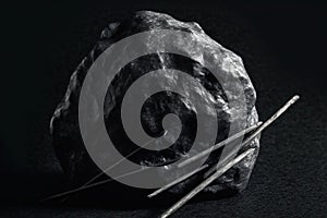 Lodestone is a rare precious natural stone on a black background. AI generated. Header banner mockup with space. photo